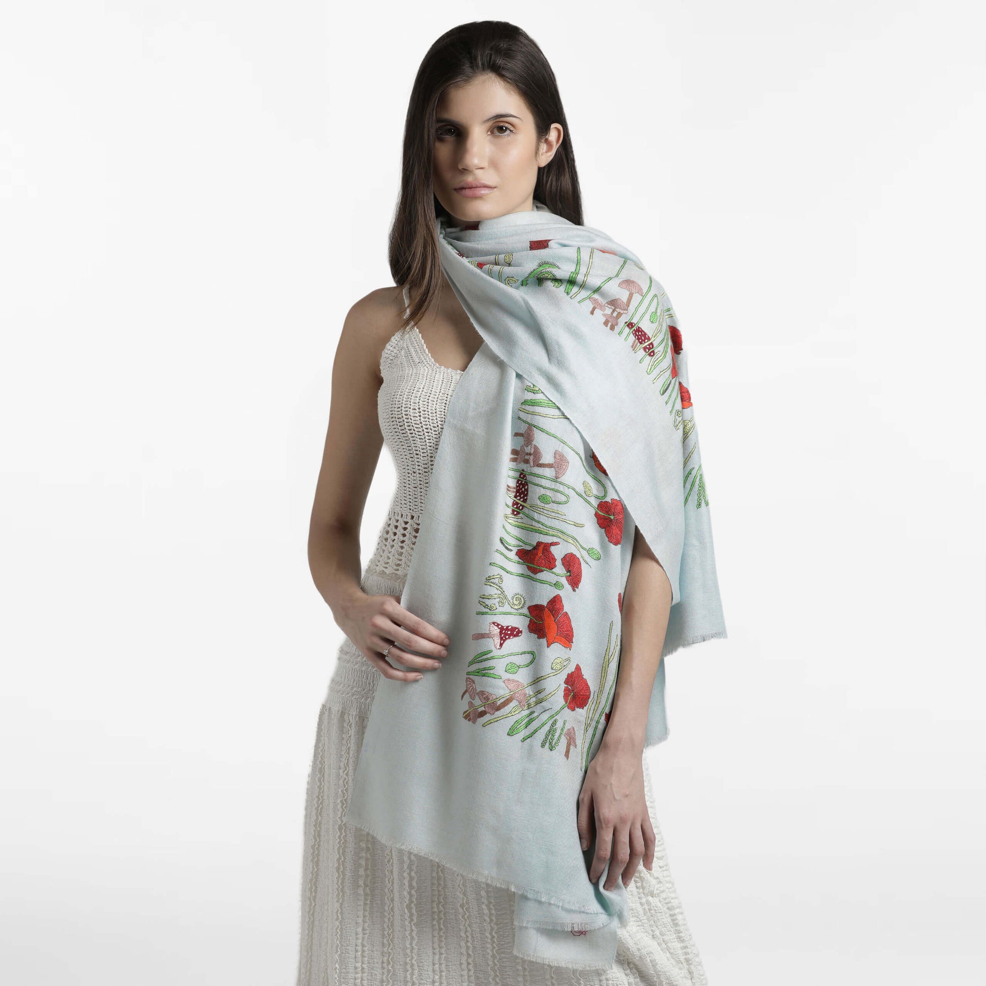 Model wearing handwoven cashmere, Poppy Ivory Butidar Radial Dye Shawl