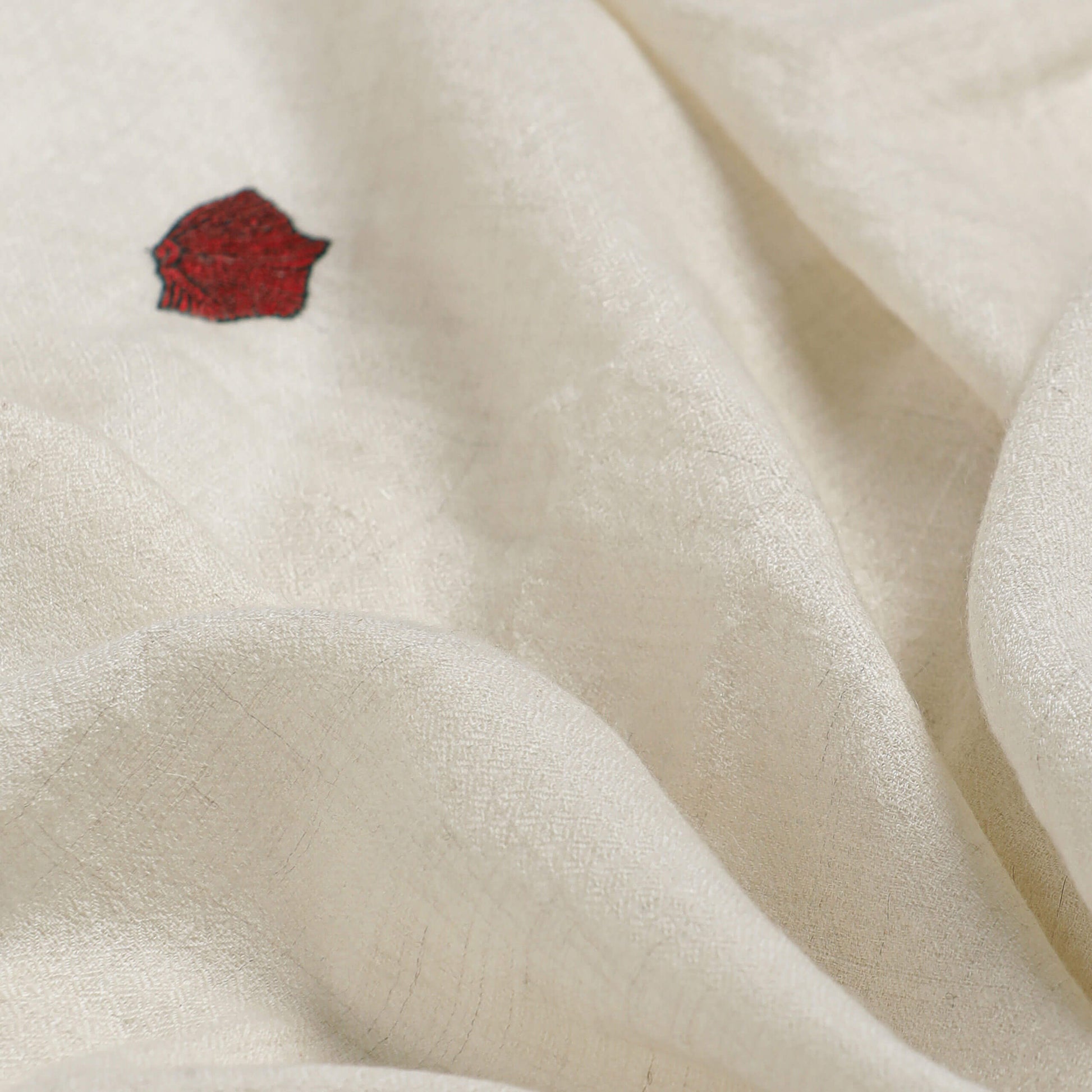 Close-up of the fine hand embroidery on handwoven cashmere, Poppy Ivory Minimal Butidar Stole