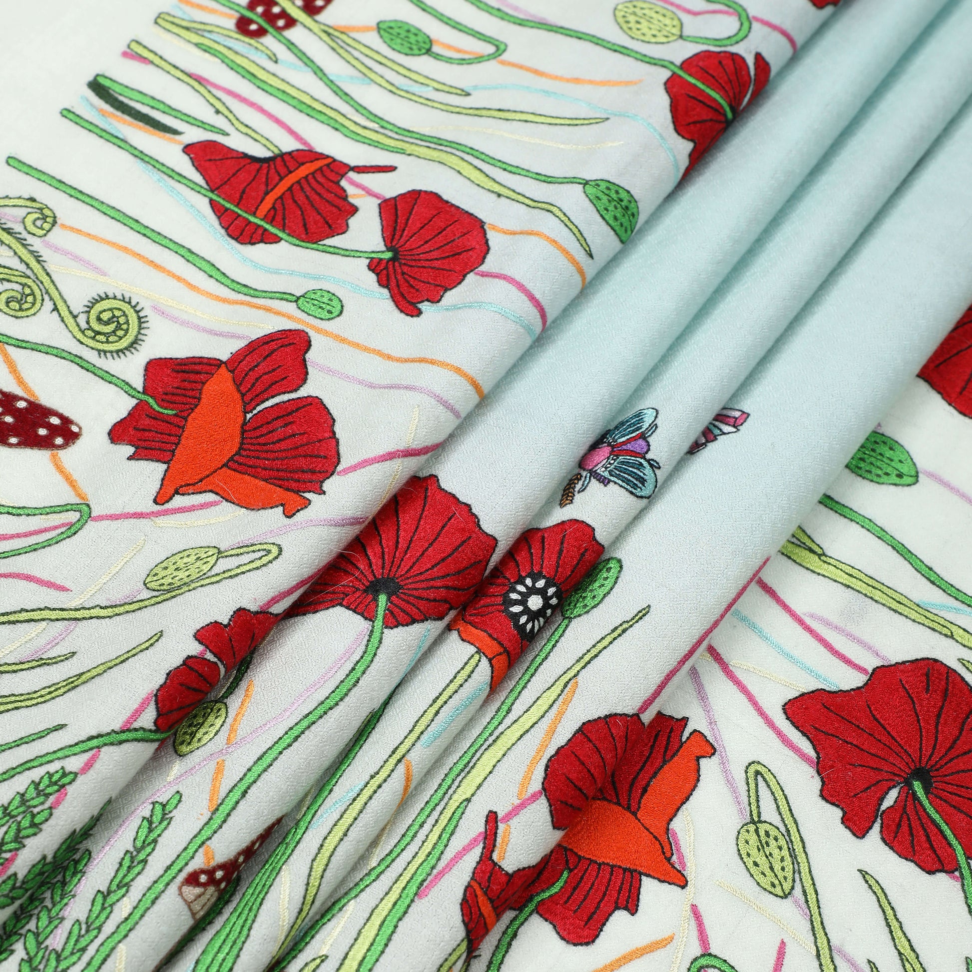 Close-up of the fine hand embroidery on handwoven cashmere, Poppy Ivory Psychedelic Bugs Radial Dye Carre